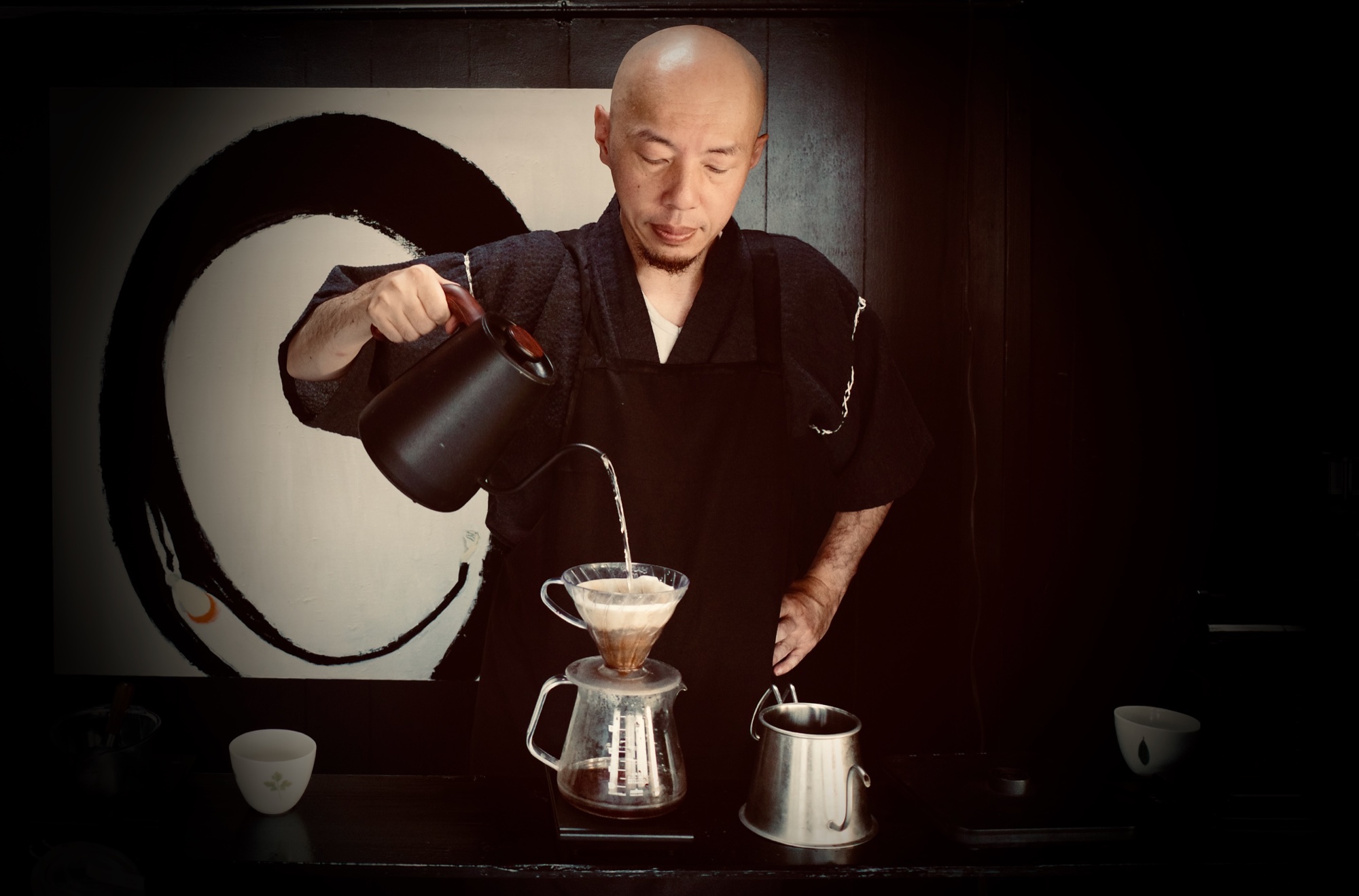 Tomotsugu Uesugi preparing hand-drip coffee